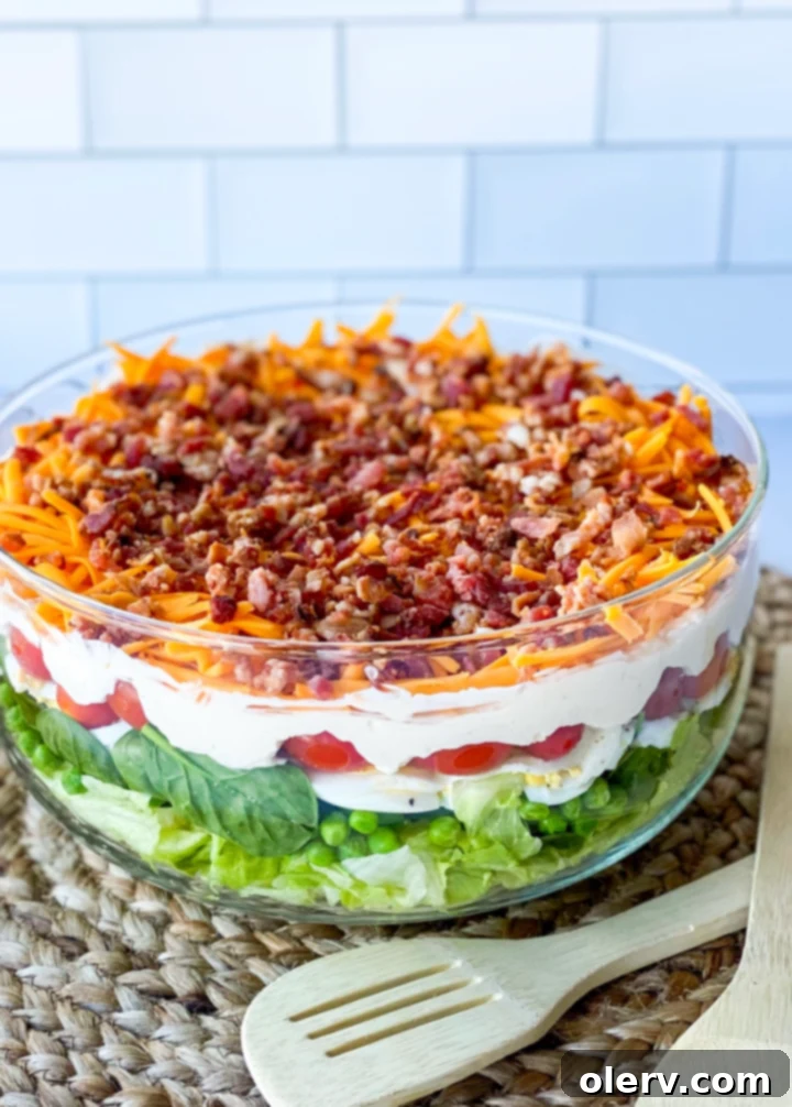 Classic Seven-Layer Salad 4 A bowl of the creamy homemade dressing, ready to be spread over the salad layers.
