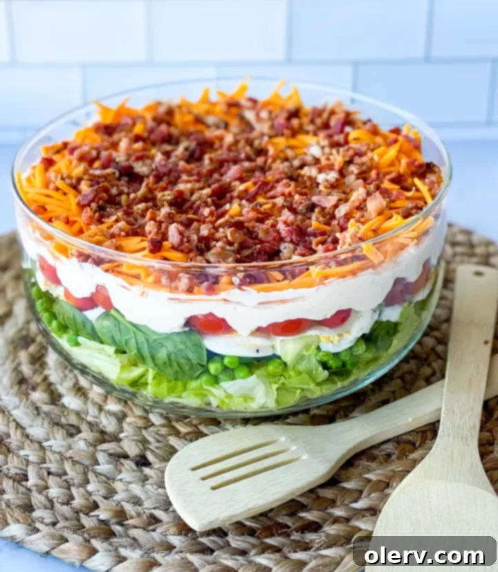 Classic Seven-Layer Salad 6 The finished 7 Layer Salad, ready to be served, in a beautiful clear bowl.