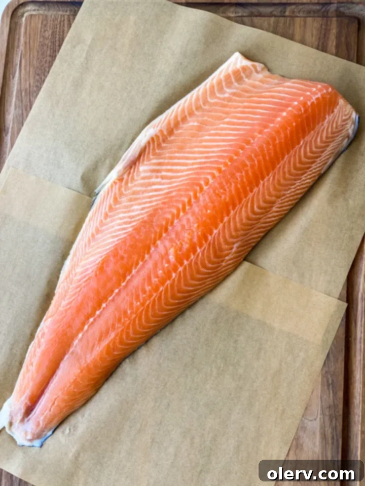 Glazed Teriyaki Salmon Bowl 4 Raw Bluehouse Salmon fillets, showcasing their fresh appearance and vibrant color, ready for grilling.