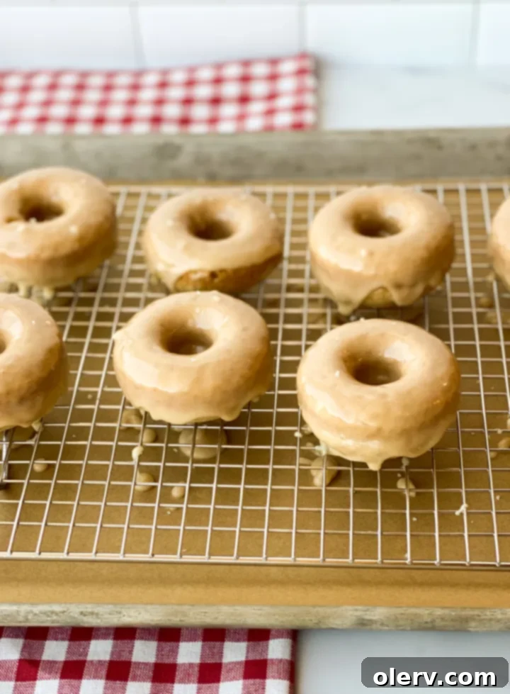 Effortless Maple Baked Donuts 4 Donut batter being piped into a donut pan, ready for baking.
