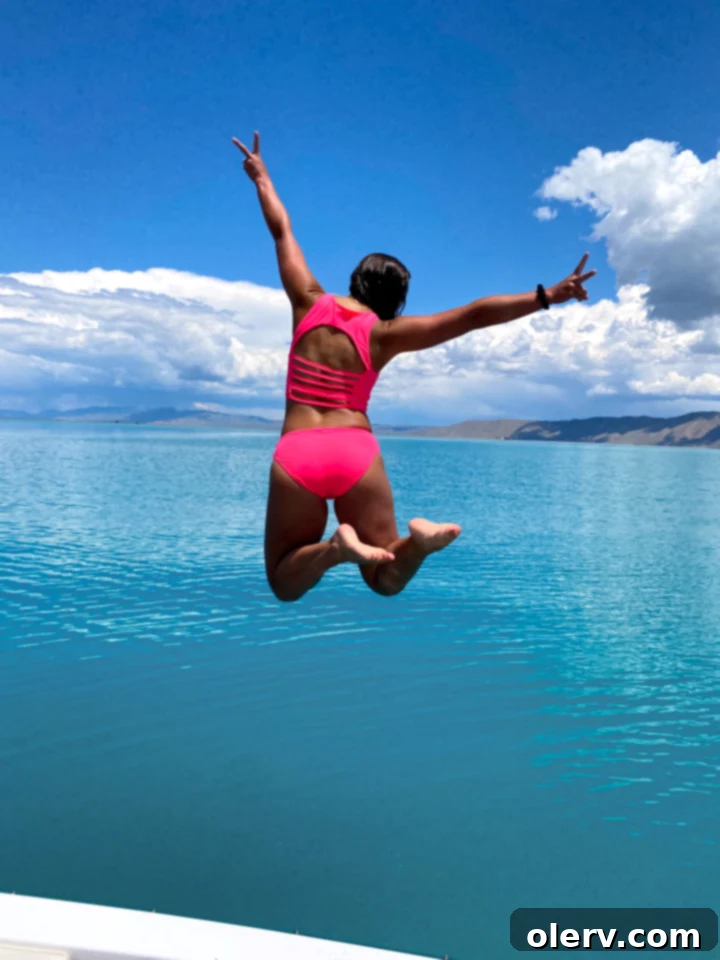 KIAVA Must-Haves 7 Smiling woman in a stylish KIAVA swimsuit.