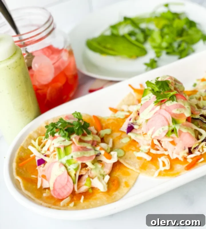 Zesty Salmon Tacos 5 Vibrant cilantro lime crema sauce in a bowl, perfect for topping fish tacos.