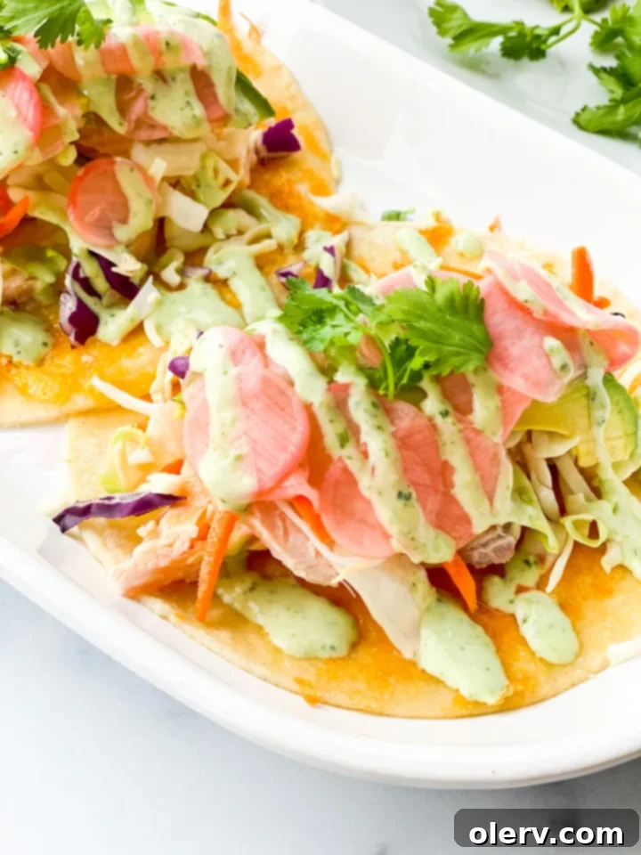 Zesty Salmon Tacos 6 A pair of hands holding a perfectly assembled salmon fish taco.