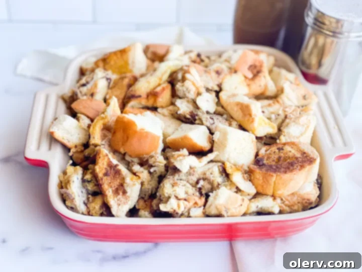 Make Ahead French Toast Bake 4 Ingredients for French toast casserole laid out: cubed bread, eggs, milk, cinnamon, vanilla, and brown sugar, ready for mixing.