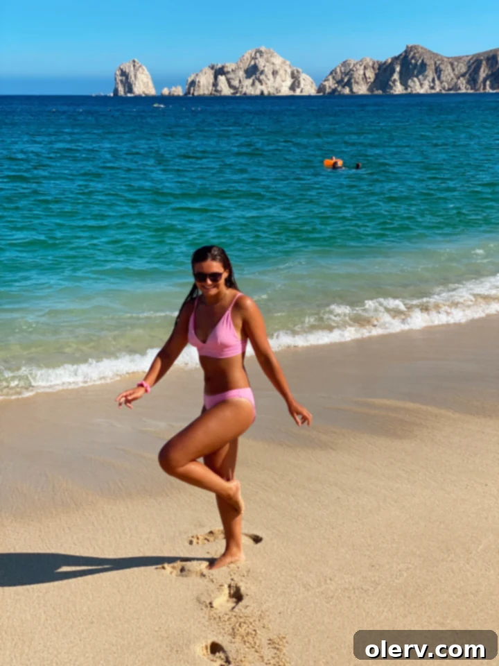 Unlock Cabo San Lucas Your Essential Guide to an Epic Escape 3 Beautiful sandy beach in Cabo San Lucas with clear ocean water and palm trees, perfect for relaxation.