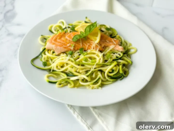 Zesty Salmon with Zucchini Ribbons 5 Zucchini noodles being tossed in a skillet with sauce