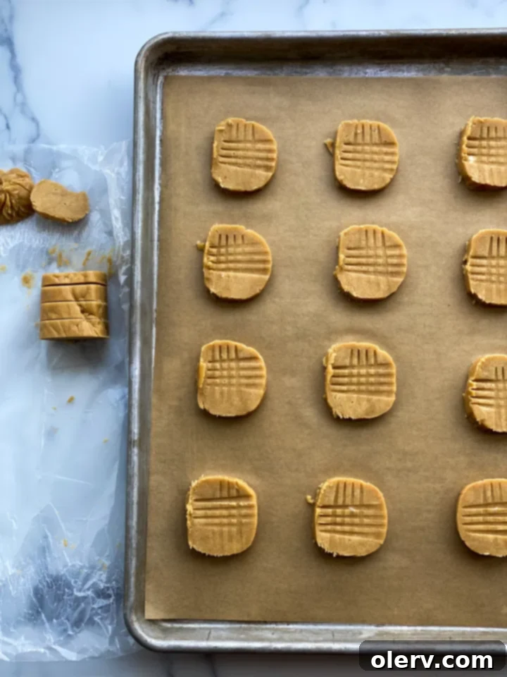 Peanut Butter Cookie Sandwiches 6 Baked peanut butter cookies cooling on a wire rack.