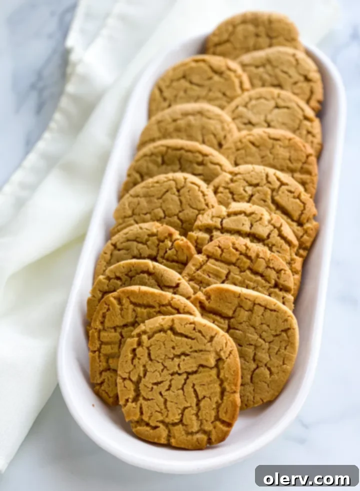 Peanut Butter Cookie Sandwiches 9 A stack of peanut butter sandwich cookies with a bite taken out of the top one.