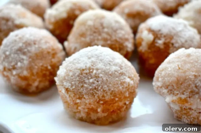 Bite-sized Pumpkin Spice Donut Holes with a sugary coating