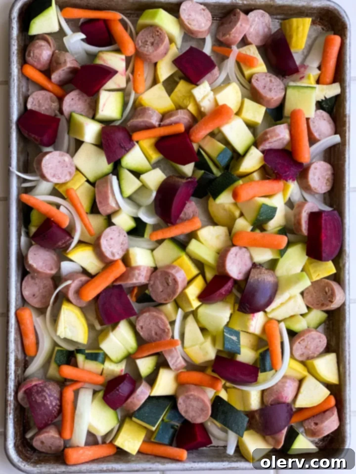 Sheet Pan Sausage and Roasted Veggies 4 Close-up of chopped raw zucchini, yellow squash, and beets, ready for the sheet pan.