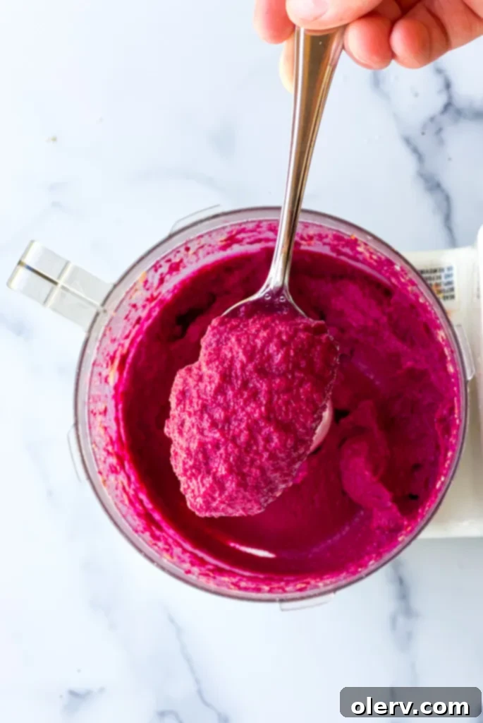 Vibrant Beet Hummus 5 Beet hummus being blended in a food processor