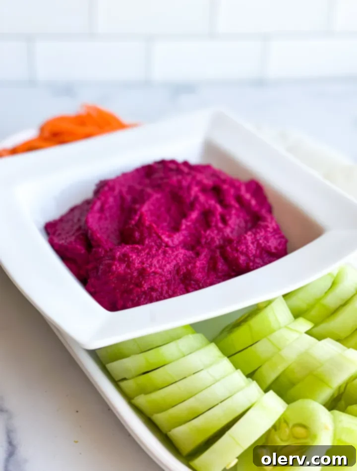 Vibrant Beet Hummus 7 Beet hummus in a bowl with crudités