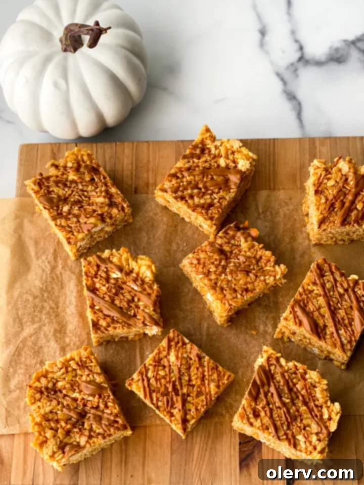 Autumn Pumpkin Crispy Delights 2 Delicious pumpkin rice krispie treats with cinnamon drizzle, perfect for fall