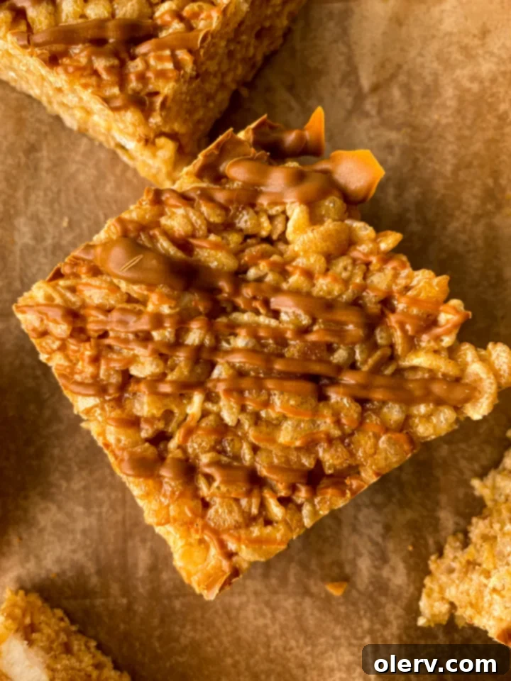 Autumn Pumpkin Crispy Delights 6 Multiple pumpkin rice krispie treats stacked on a plate, ready to be served