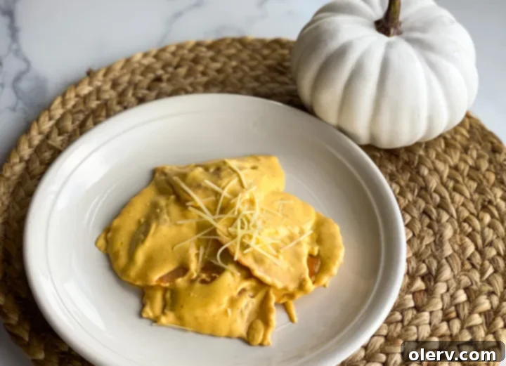 Creamy Pumpkin Alfredo 3 All the ingredients for Pumpkin Alfredo Sauce laid out on a kitchen counter: butter, garlic, cream cheese, Parmesan, milk, pure pumpkin, and garlic salt.