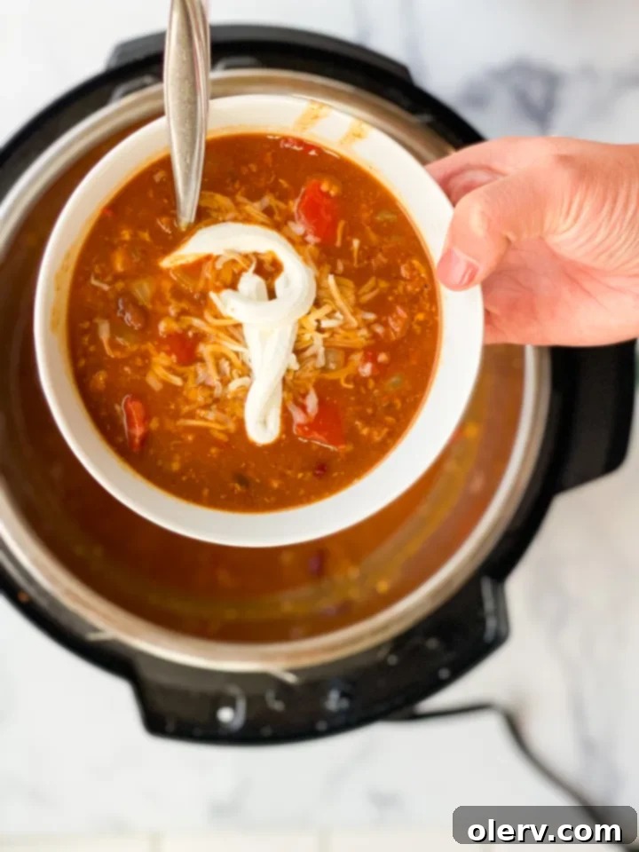 Hearty Pumpkin Chili Recipe 5 Various canned goods and fresh ingredients assembled for cooking pumpkin chili.