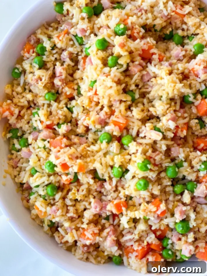Quick Instant Pot Ham Fried Rice 4 Diced ham, frozen peas and carrots, and other ingredients for ham fried rice laid out on a counter.