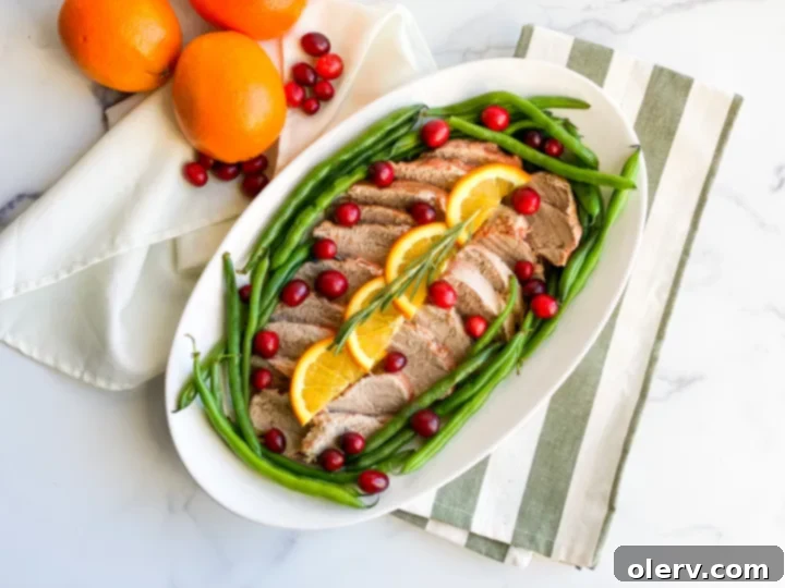 Instant Pot Cranberry Orange Glazed Pork Tenderloin 7 Serving of Instant Pot Cranberry Orange Pork Tenderloin with the thickened sauce.