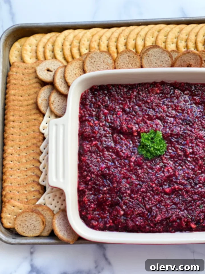 Creamy Cranberry Delight 2 Cranberry Cream Cheese Dip served on a platter with crackers