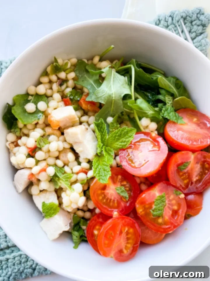 Vibrant Lemon Arugula Couscous Medley 4 Ingredients for lemon arugula couscous salad laid out on a kitchen counter, showcasing freshness.