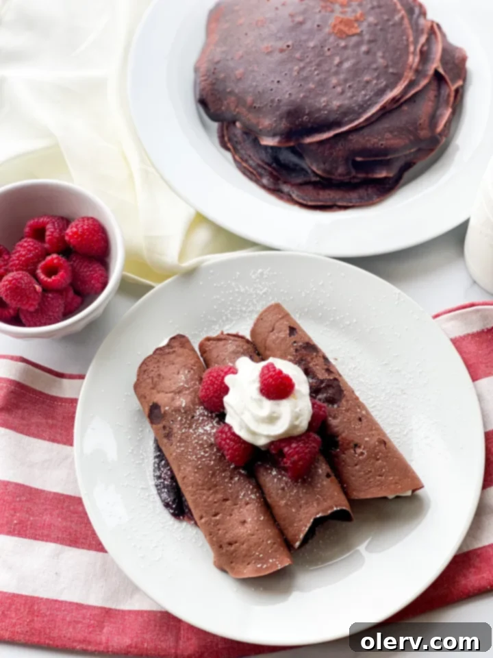 Flipping a chocolate crepe in a nonstick pan