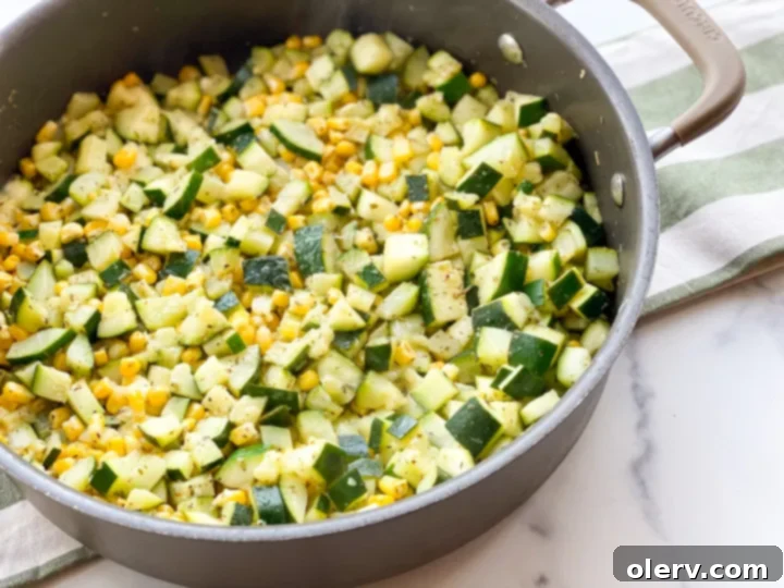 Savory Zucchini Side 3 Close-up of the zucchini and corn mixture cooking in a large skillet