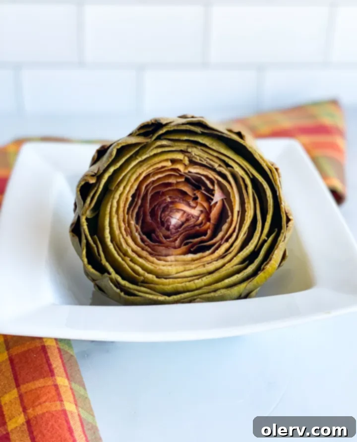 Easy Instant Pot Artichokes 7 Perfectly cooked Instant Pot Artichokes served with melted butter