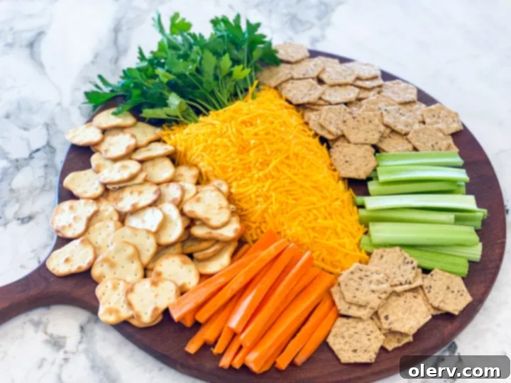 A close-up shot of the mixed cheese ball ingredients in a large bowl, showing a creamy, light orange mixture.