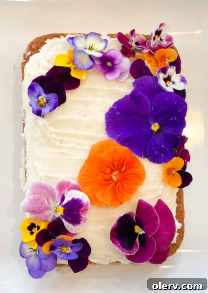 Mother's Day Celebration 6 Slice of apple sheet cake with brown butter frosting and edible flower decoration