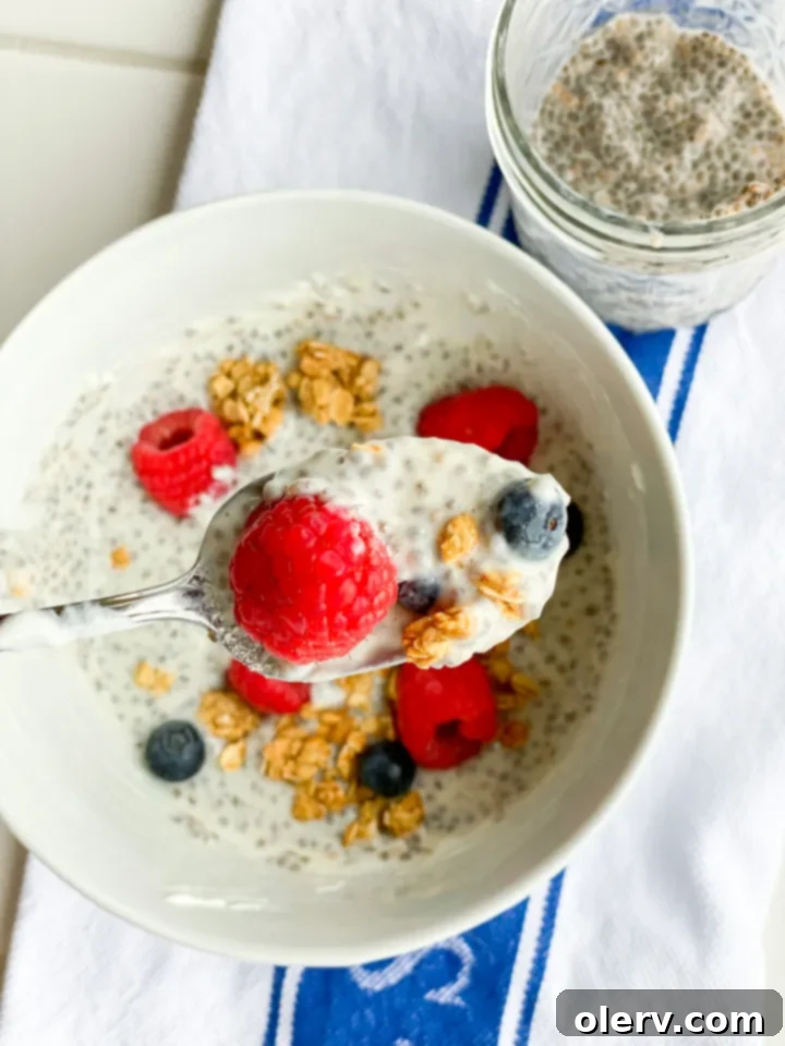Power-Packed Chia Seed Parfait 5 Ingredients for Protein Chia Seed Parfait laid out on a kitchen counter: chia seeds, almond milk, Greek yogurt, protein powder, and honey.