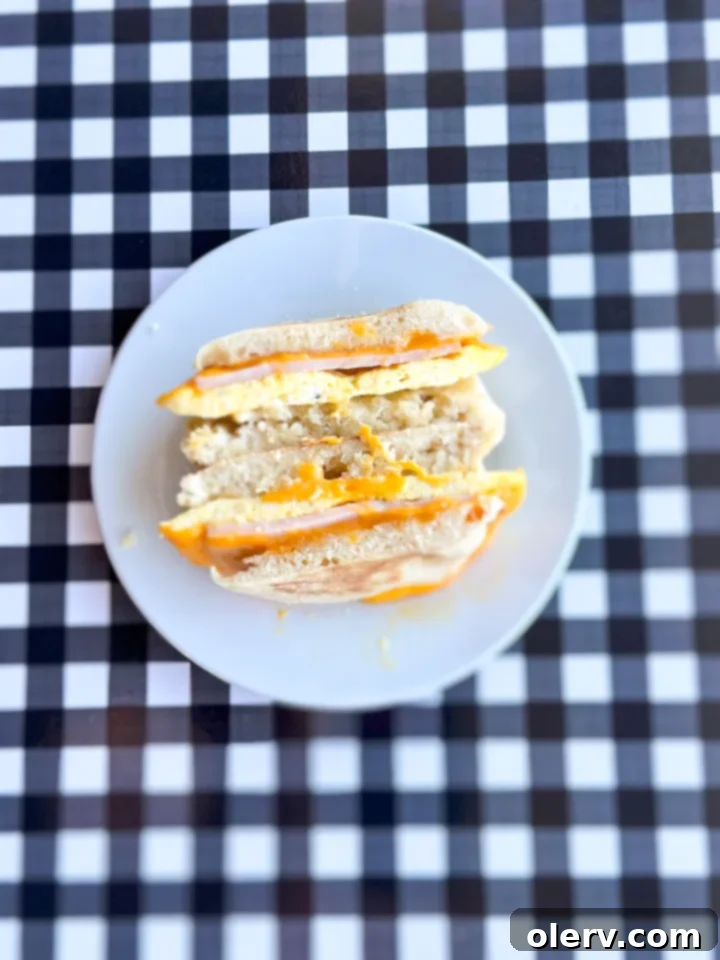 Instant Breakfast Sandwich 3 Assorted ingredients for a breakfast sandwich including English muffins, butter, ham, and cheese