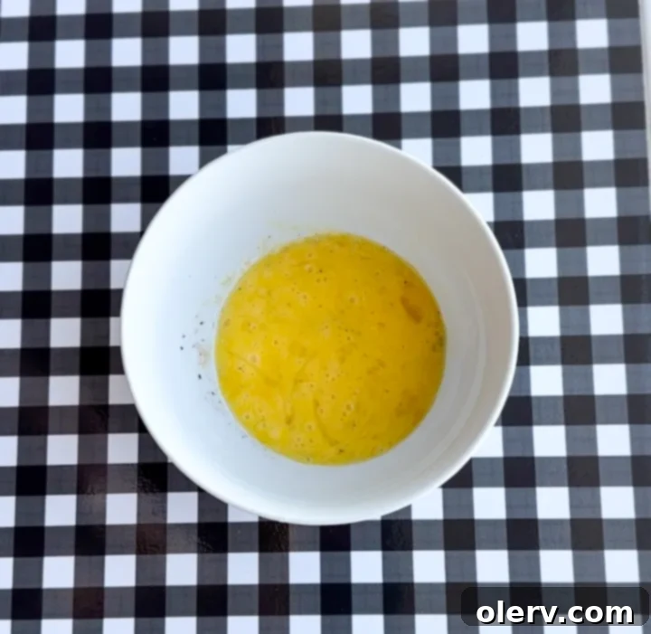Instant Breakfast Sandwich 6 Step 2: Microwaving a bowl with a whisked egg