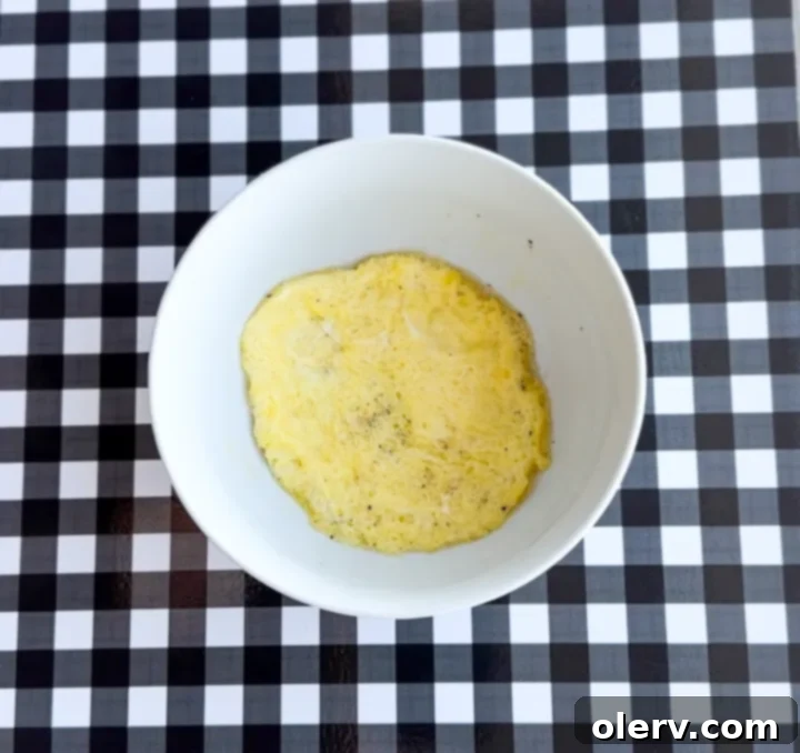 Instant Breakfast Sandwich 7 Step 3: Perfectly cooked egg patty in a glass bowl after microwaving