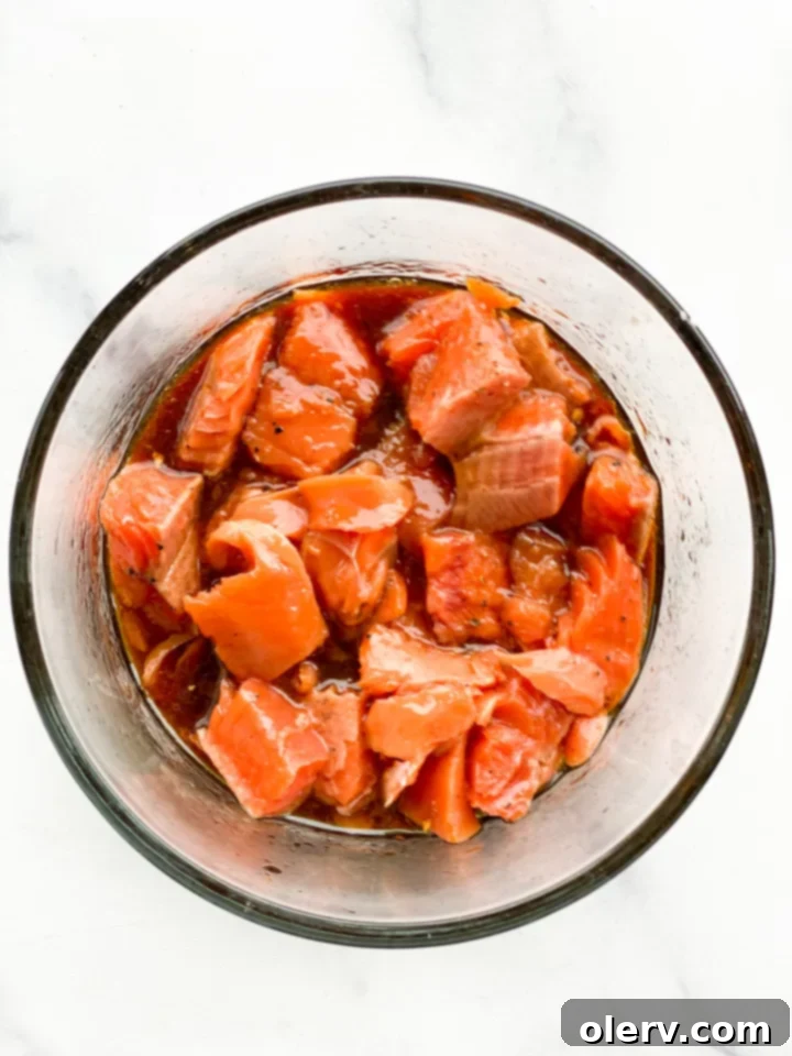 Ultimate Salmon Rice Bowl 4 Close up of cubed salmon being marinated
