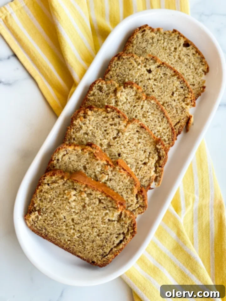 Tangy Twist Banana Loaf 7 A beautifully baked sourdough banana bread loaf, ready to be sliced and enjoyed