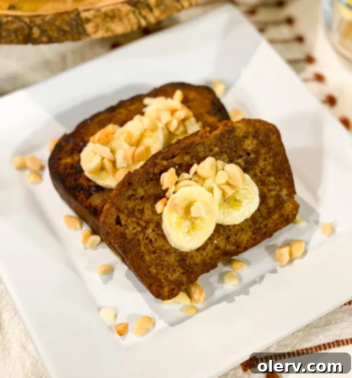Heavenly Banana Bread French Toast 7 Stacked Banana Bread French Toast with coconut syrup, bananas, and macadamia nuts