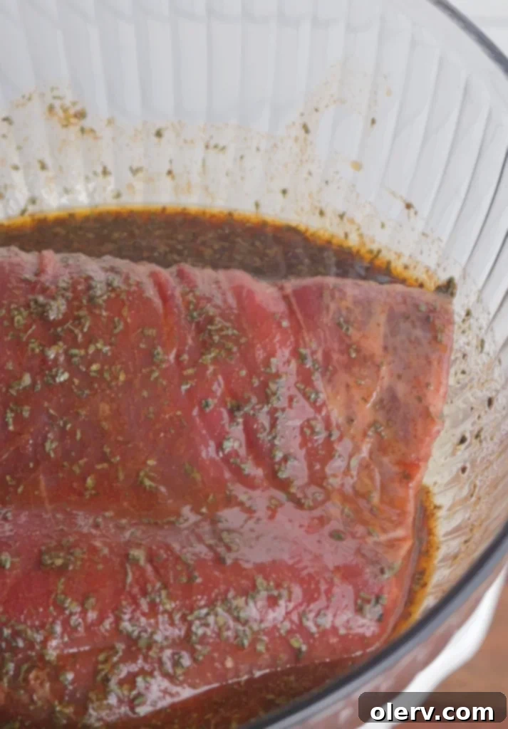 Master Flank Steak Marinade 3 Close-up of Marinated Flank Steak in a Bowl