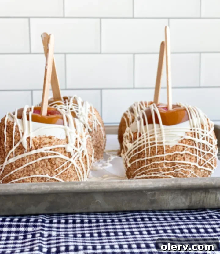 Easy Homemade Caramel Apples 7 Caramel apples setting on parchment paper