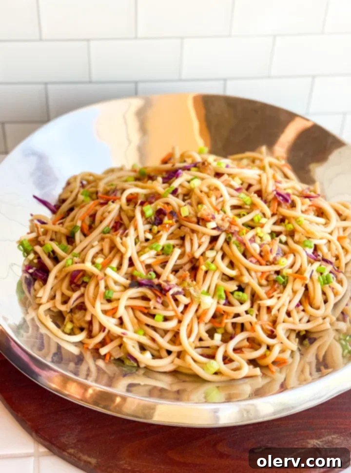 Irresistible Udon Stir-Fry 5 All stir-fry ingredients prepped and laid out on a cutting board, including chopped onions, garlic, cabbage, and carrots.