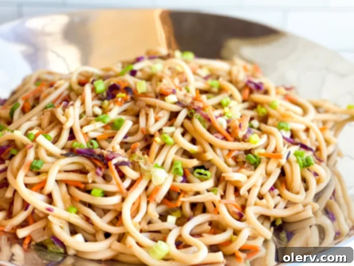 Irresistible Udon Stir-Fry 6 A large wok filled with freshly cooked stir-fry udon noodles and vegetables, ready to be served.