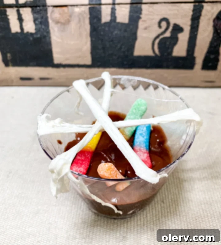 Monster Munchie Cups 4 Worms & Webs Halloween dessert cup with chocolate pudding, crushed Oreos, and gummy worms
