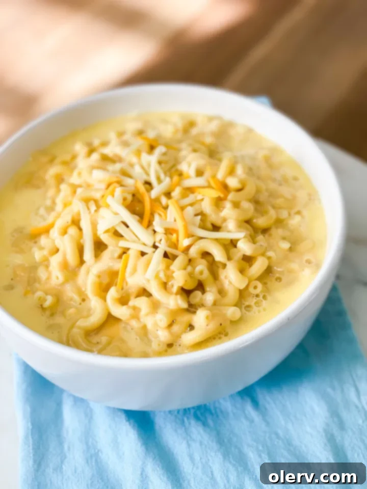 Creamy Instant Pot Mac and Cheese 4 Instant Pot filled with perfectly cooked pasta and the creamy, melted cheese sauce.