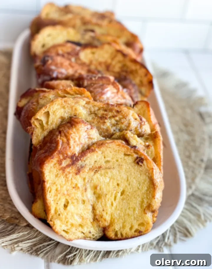 Thick-Cut Cinnamon Bliss French Toast 5 Freshly mixed French toast custard in a shallow baking dish, ready for dipping chunky bread slices