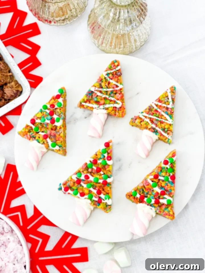 The Grinch's Feast 10 Whoville Treats - colorful Fruity Pebbles cereal bar Christmas trees decorated with sprinkles and white chocolate