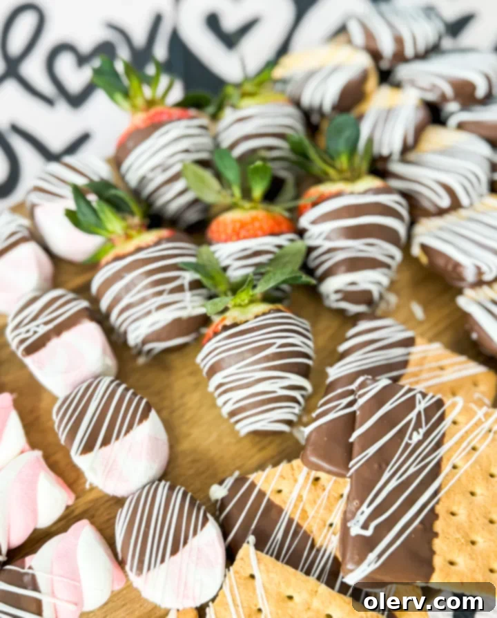 Decadent Chocolate Charcuterie 4 Close-up of freshly chocolate-dipped strawberries and other treats ready for decorating