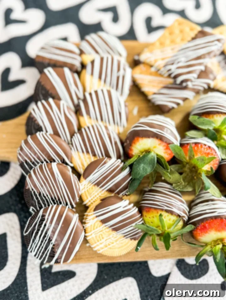 Decadent Chocolate Charcuterie 5 An array of colourful and decorative chocolate-dipped sweets arranged on a large platter