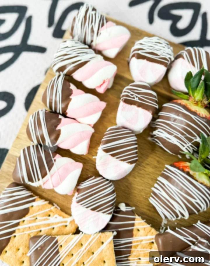 Decadent Chocolate Charcuterie 6 Delicious chocolate-dipped cookies and marshmallows arranged on a festive serving tray