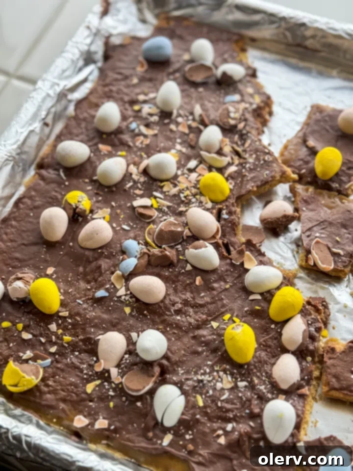 Unlocking the Cadbury Egg 3 Sheet pan filled with graham crackers, butter, caramel, and chocolate, ready for Cadbury eggs