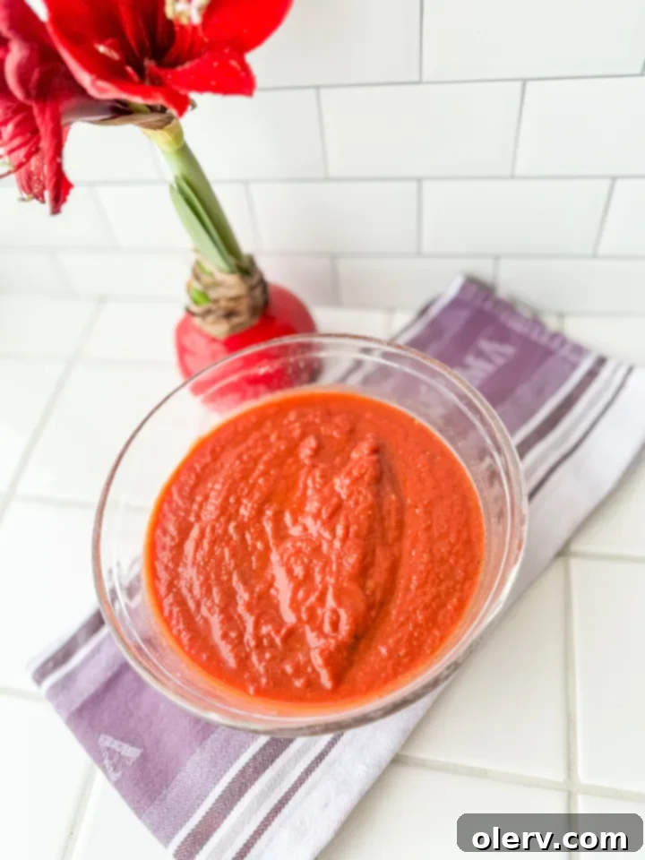 The Ultimate Marinara Sauce 3 Close-up of fresh marinara sauce simmering in a pot