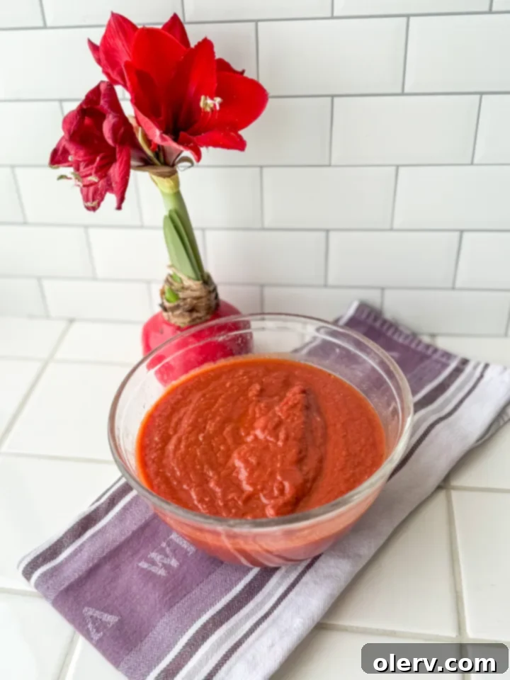 The Ultimate Marinara Sauce 4 Fresh tomatoes, olive oil, and herbs on a wooden board